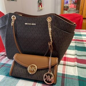 Michael Kors brown handbag with matching wallet.